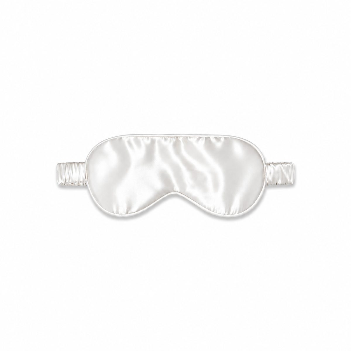 Masque de sommeil en soie Scrunch'it Silk blanc avec bande élastique, sur fond blanc.